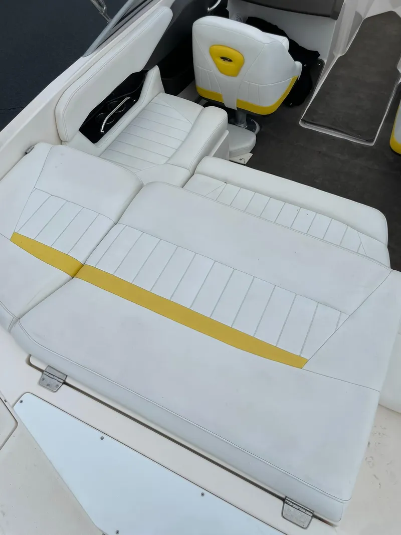 Slide: The Image of 2006 Regal 2000 Bowrider interior with white and yellow seating. - 9