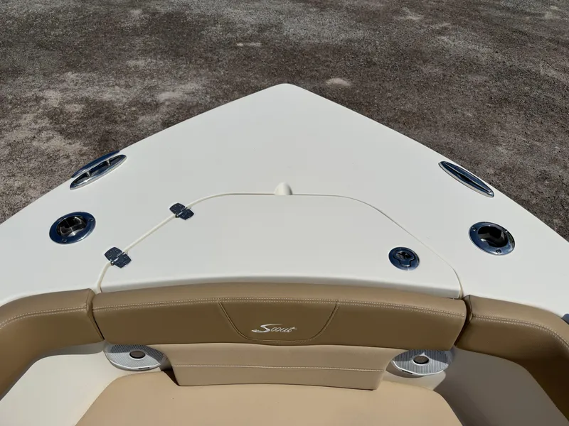 Slide: The Image of 2019 Scout 235 XSF boat bow with beige seating and stainless steel fixtures. - 18