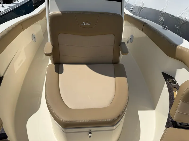 Slide: The Image of 2019 Scout 235 XSF boat with beige seating and armrests. - 20