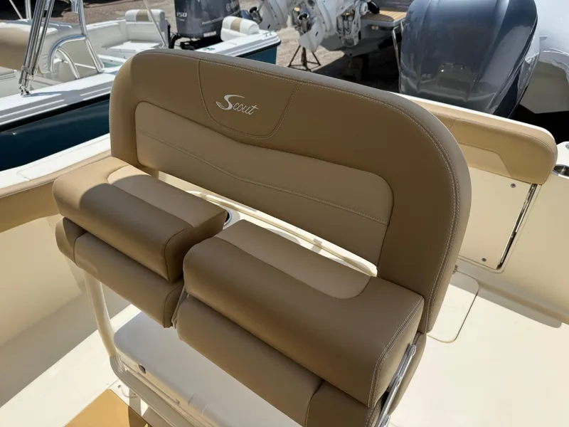 Slide: The Image of 2019 Scout 235 XSF boat seat with tan upholstery and logo. - 21