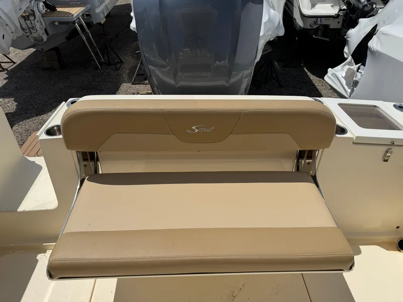 Slide: The Image of 2019 Scout 235 XSF boat seat with beige upholstery and logo. - 25
