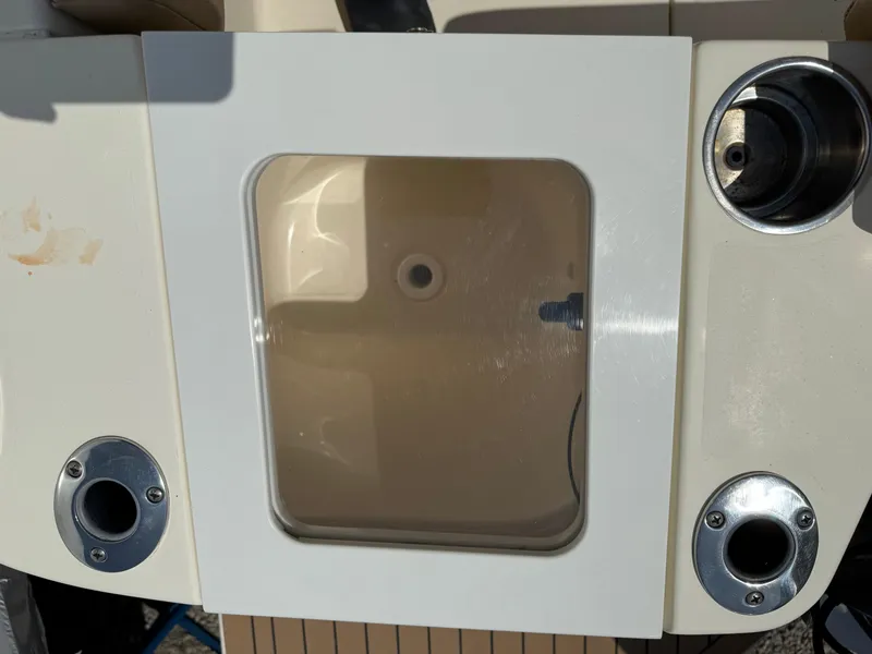 Slide: The Image of 2019 Scout 235 XSF boat livewell with rod holders and clean design. - 29