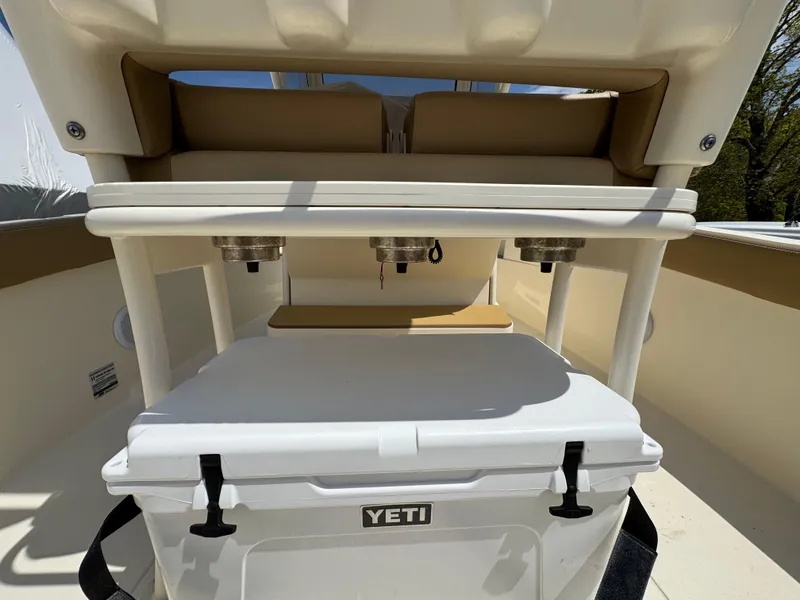 Slide: The Image of 2019 Scout 235 XSF boat interior with Yeti cooler and seating area. - 44