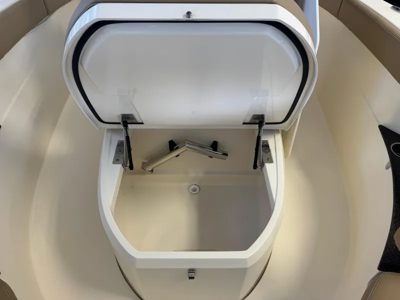 Slide: The Image of Open storage compartment on 2019 Scout 235 XSF boat. - 54