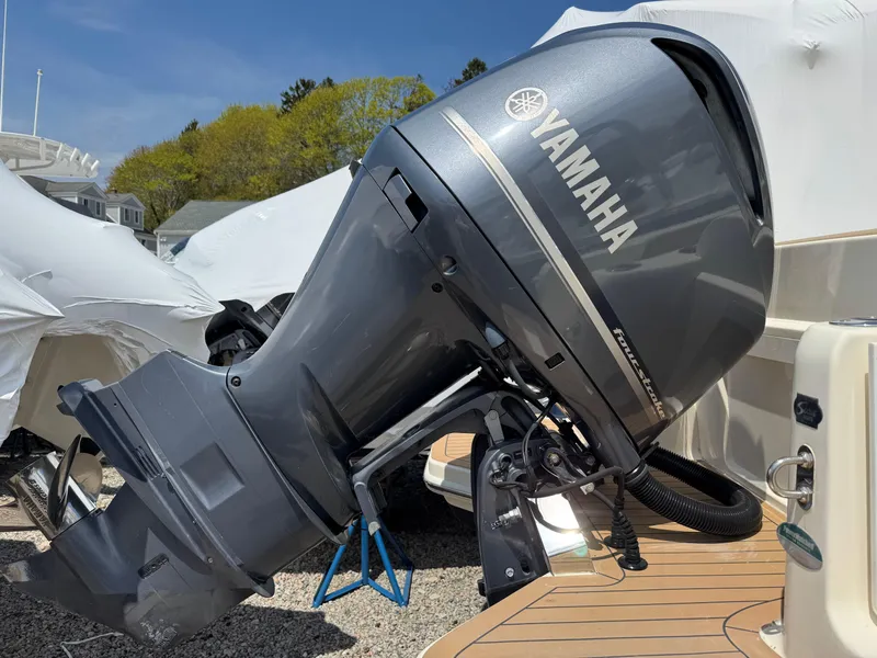Slide: The Image of 2019 Scout 235 XSF with Yamaha outboard motor, docked and covered. - 7