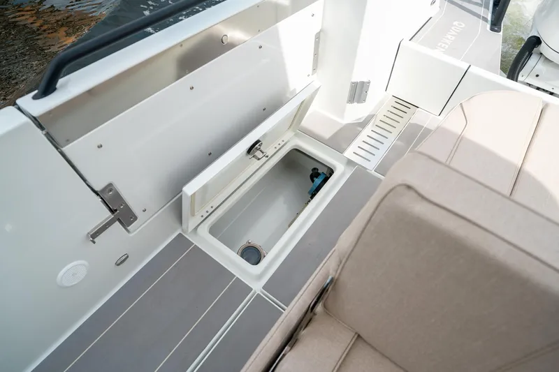 Slide: The Image of 2025 Quarken 35 Sport Tourer boat interior with open storage compartment. - 19