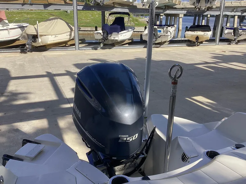 Slide: The Image of 2017 Stingray 234 LR boat with Yamaha 250 outboard motor in marina. - 13