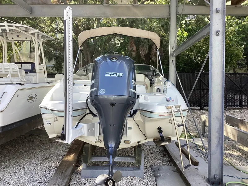 Slide: The Image of 2017 Stingray 234 LR boat with Yamaha 250 engine in storage. - 3
