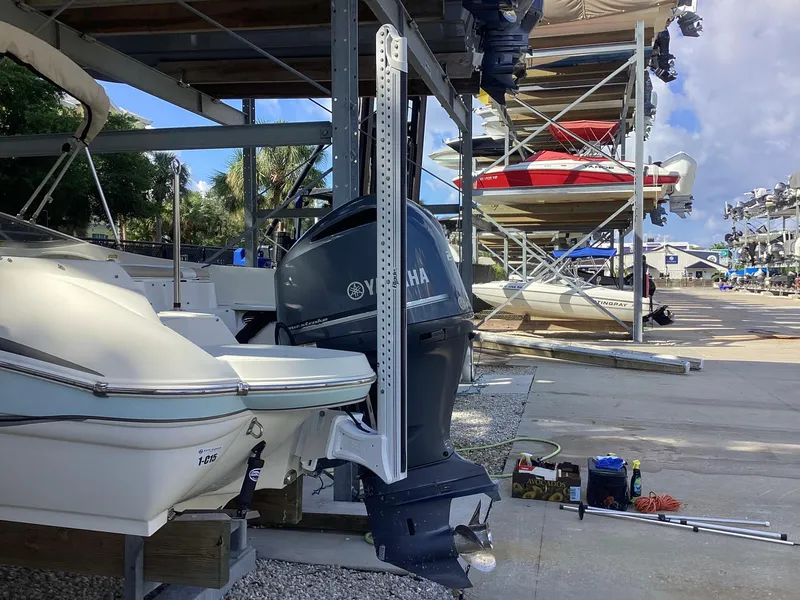 Slide: The Image of 2017 Stingray 234 LR boat with Yamaha outboard motor in marina storage. - 4