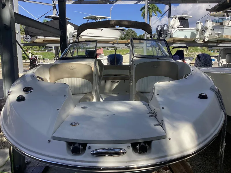 Slide: The Image of 2017 Stingray 234 LR boat in storage, showcasing sleek design and spacious seating. - 9
