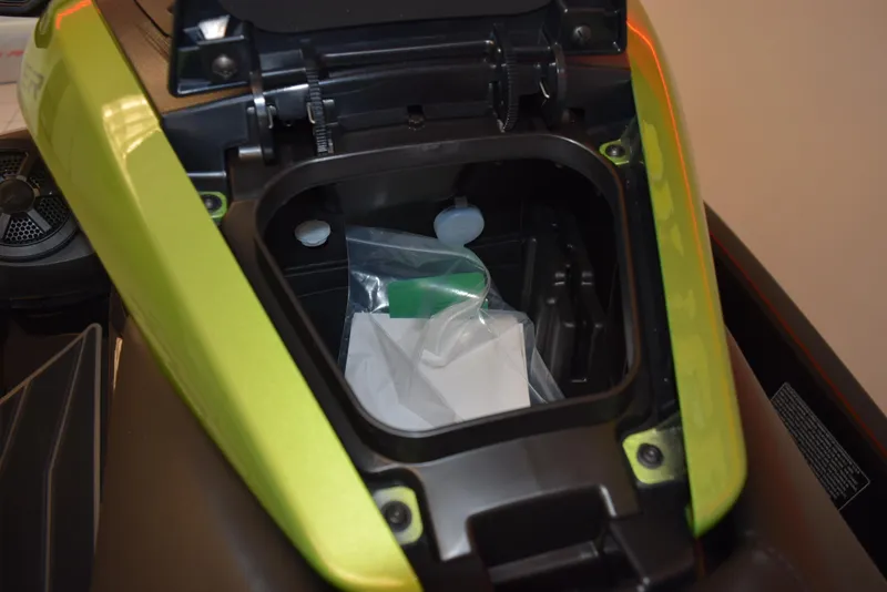Slide: The Image of 2024 Yamaha WaveRunner FX Cruiser SVHO storage compartment open, showing interior space. - 11