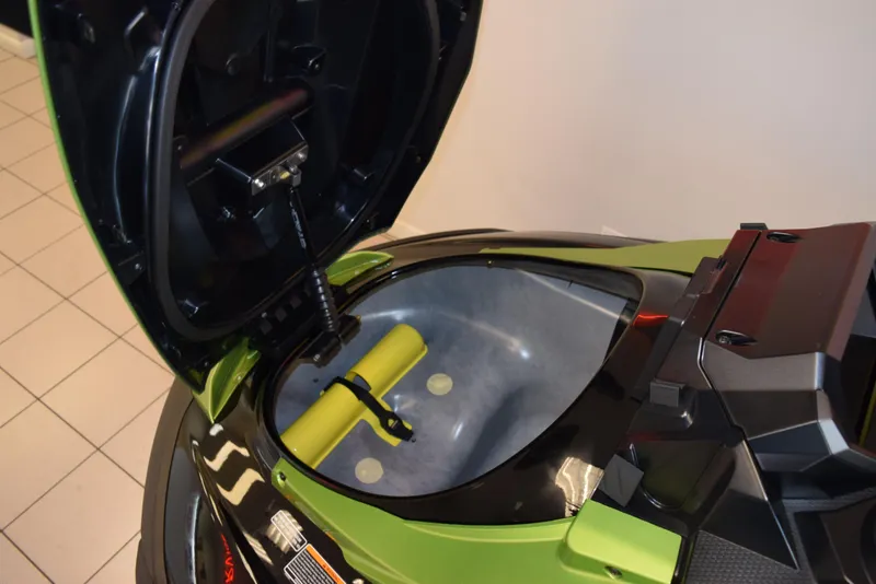 Slide: The Image of 2024 Yamaha WaveRunner FX Cruiser SVHO storage compartment open, showcasing interior space. - 12