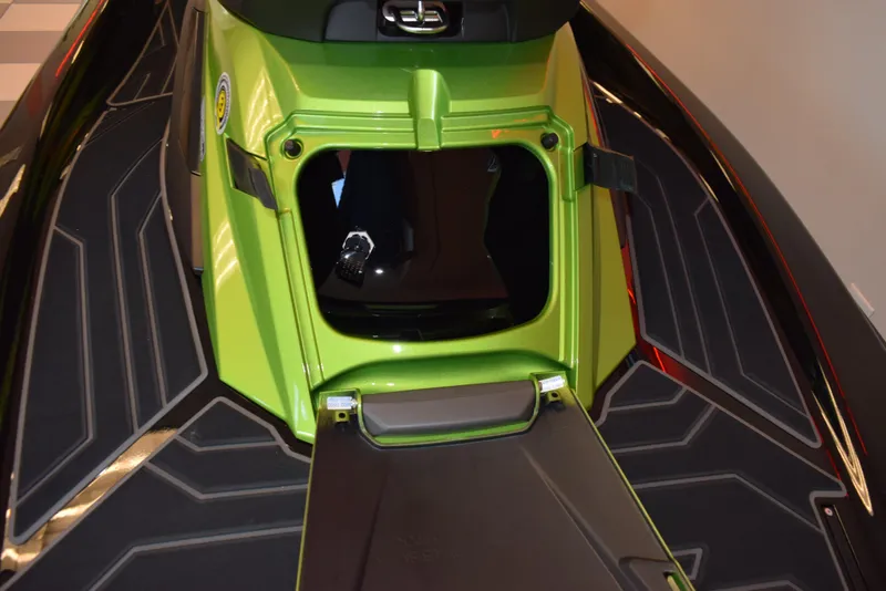Slide: The Image of 2024 Yamaha WaveRunner FX Cruiser SVHO, green, open storage compartment, black deck. - 13