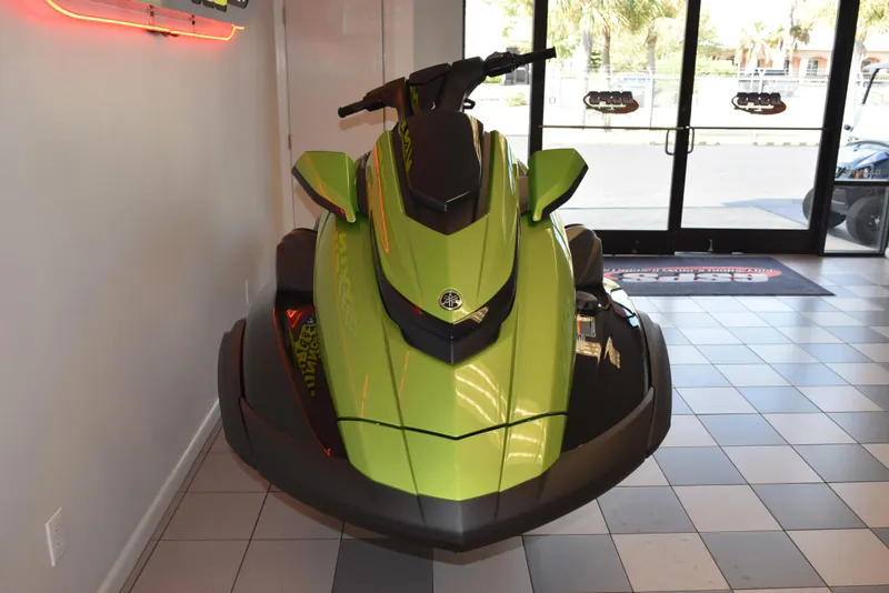 Slide: The Image of 2024 Yamaha WaveRunner FX Cruiser SVHO in showroom, vibrant green color. - 3
