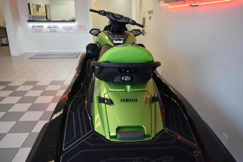 Slide: The Image of 2024 Yamaha WaveRunner FX Cruiser SVHO in showroom, green and black design. - 5