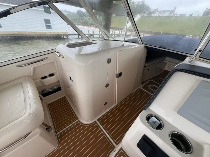 Slide: The Image of 2021 Grady-White 285 Freedom boat interior with sleek design and wood-patterned flooring. - 14