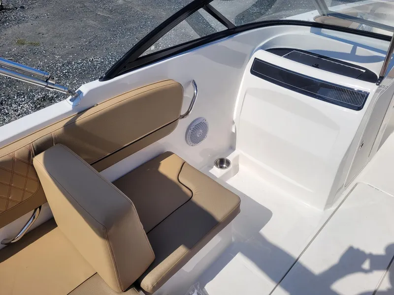 Slide: The Image of 2025 Bayliner VR4 Bowrider OB interior with beige seating and modern design. - 10