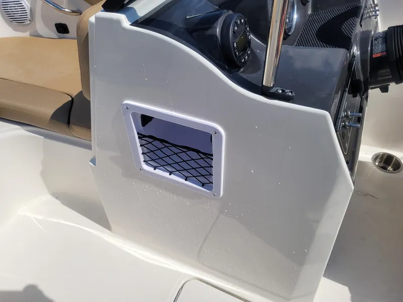 Slide: The Image of 2025 Bayliner VR4 Bowrider OB dashboard with storage net and seating. - 14