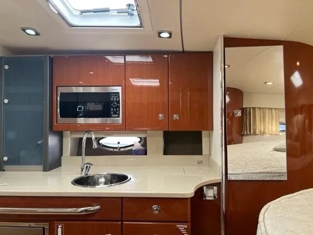 Slide: The Image of Luxurious 2011 Formula 34 PC yacht interior with modern kitchen and cozy bedroom. - 17
