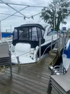 Slide: The Image of 2011 Formula 34 PC yacht docked at marina under cloudy sky. - 2