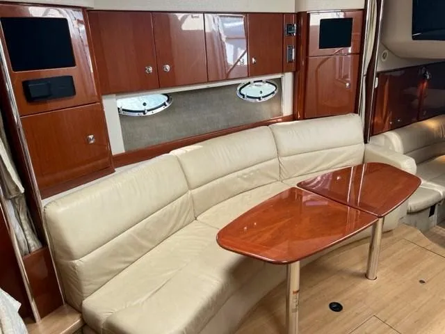 Slide: The Image of Luxurious interior of 2011 Formula 34 PC yacht with leather seating and wooden table. - 20