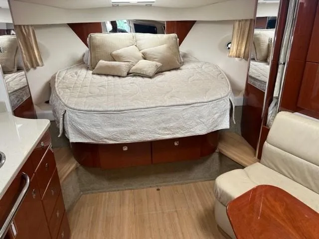 Slide: The Image of Luxurious 2011 Formula 34 PC yacht interior with cozy bed and elegant wood finishes. - 21