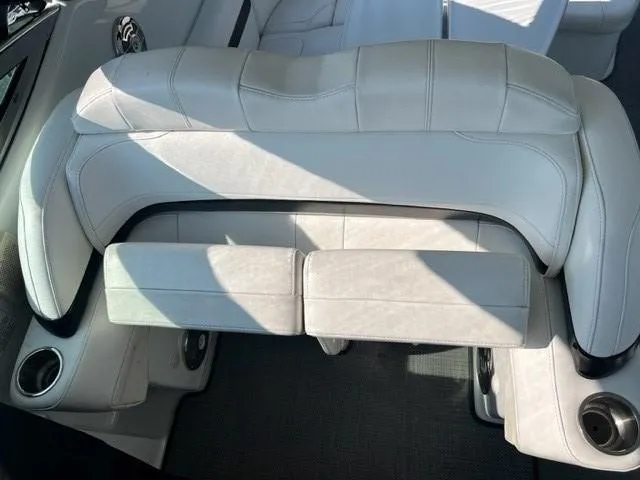 Slide: The Image of 2011 Formula 34 PC boat interior with white leather seating and cup holders. - 23