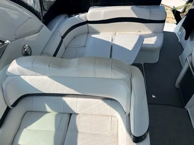 Slide: The Image of 2011 Formula 34 PC boat interior with white leather seating. - 24