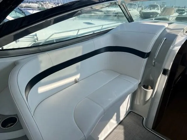 Slide: The Image of 2011 Formula 34 PC boat interior with white seating and sleek design. - 25