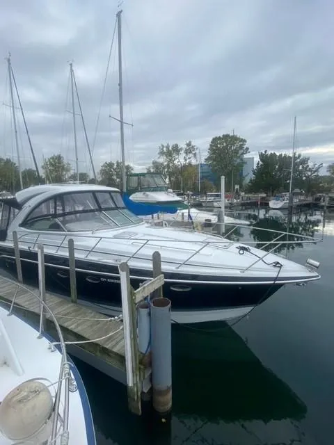 Slide: The Image of 2011 Formula 34 PC yacht docked at marina under cloudy sky. - 4
