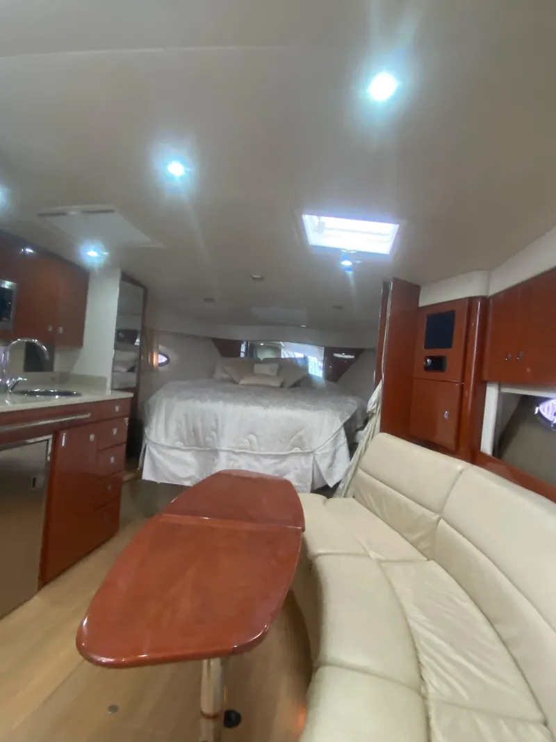 Slide: The Image of 2011 Formula 34 PC yacht interior with bed, sofa, and kitchenette. - 8