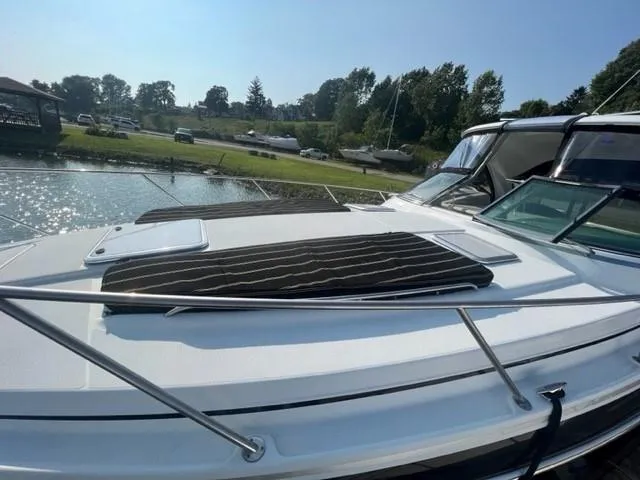 Slide: The Image of 2011 Formula 34 PC boat docked by a scenic lakeside. - 9