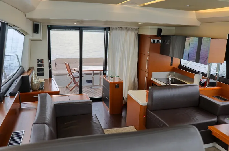 Slide: The Image of Luxurious interior of a 2015 Prestige 520 yacht with modern furnishings and outdoor seating. - 10