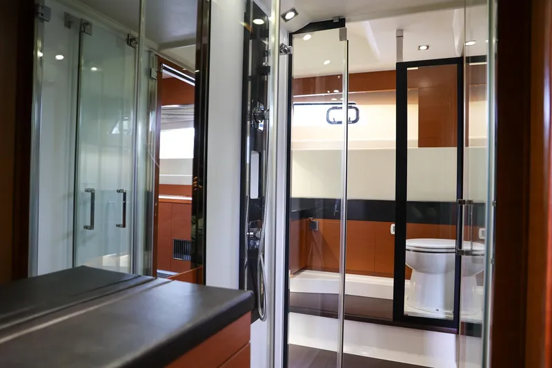 Slide: The Image of Luxurious bathroom interior of 2015 Prestige 520 yacht with modern fixtures and glass doors. - 14