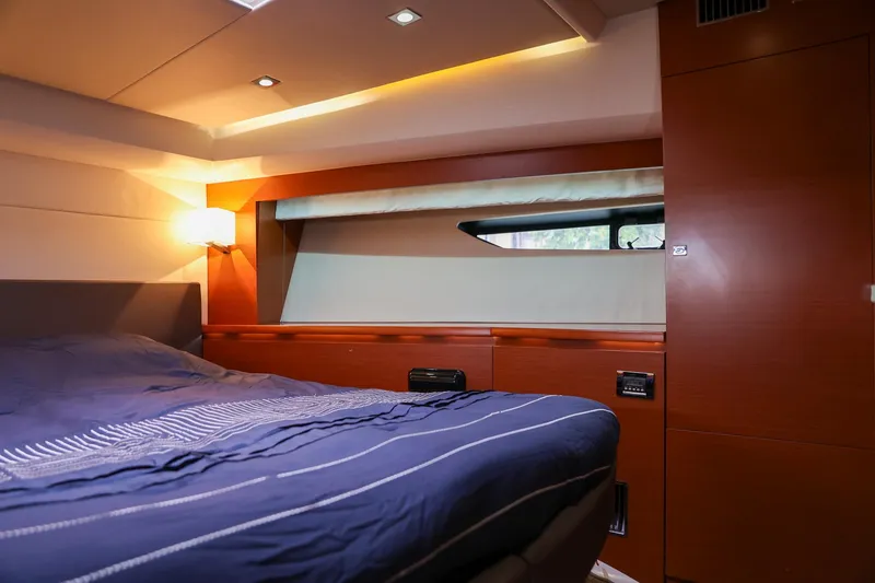 Slide: The Image of Luxurious cabin interior of a 2015 Prestige 520 yacht with modern wood finishes. - 24