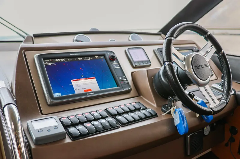 Slide: The Image of Prestige 520 yacht helm with navigation system and steering wheel, 2015 model. - 3