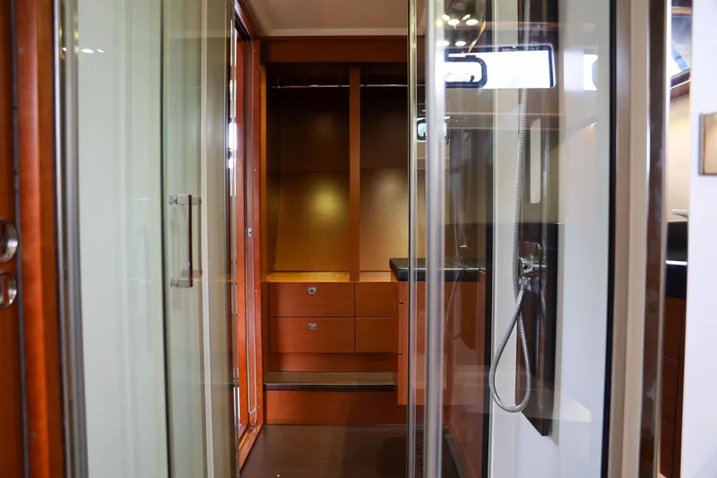 Slide: The Image of Luxurious interior of 2015 Prestige 520 yacht with wooden cabinetry and modern shower. - 6