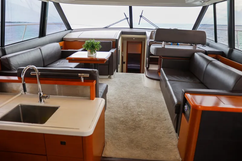 Slide: The Image of Luxurious interior of a 2015 Prestige 520 yacht with modern furnishings and ocean view. - 7
