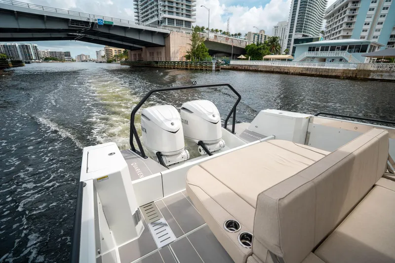 Slide: The Image of 2025 Quarken 35 Sport Tourer cruising under a city bridge. - 10