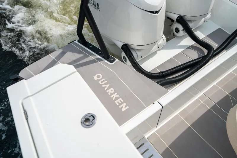 Slide: The Image of 2025 Quarken 35 Sport Tourer boat with dual engines on water. - 16