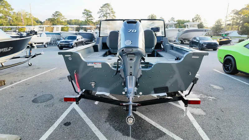 Slide: The Image of 2025 Starcraft Storm 166 DC Pro boat with 70 HP engine in parking lot. - 5