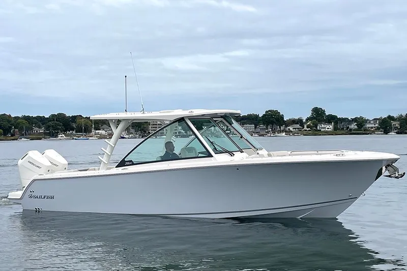 Slide: The Image of 2025 Sailfish 316 DC boat on calm water, side view. - 2