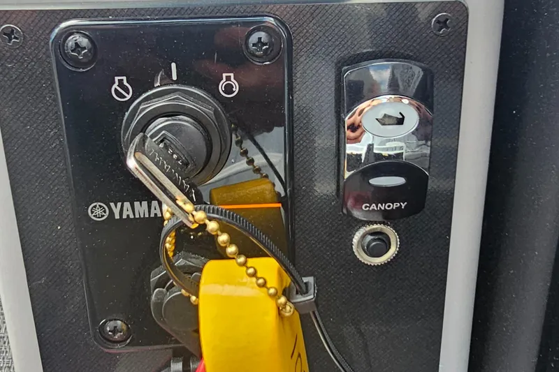 Slide: The Image of Control panel of a 2025 Barletta A22UC with Yamaha ignition and canopy switch. - 13