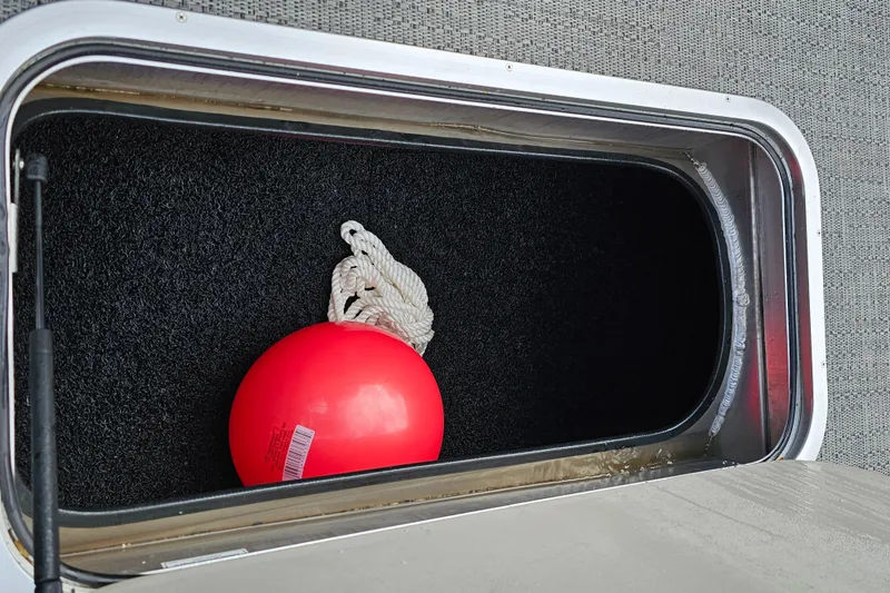 Slide: The Image of Storage compartment in 2025 Barletta A22UC boat with red buoy and rope. - 15