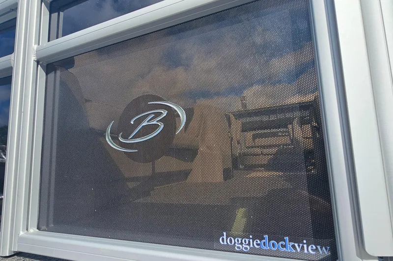 Slide: The Image of Barletta A22UC 2025 boat window with "doggiedockview" feature and logo. - 20