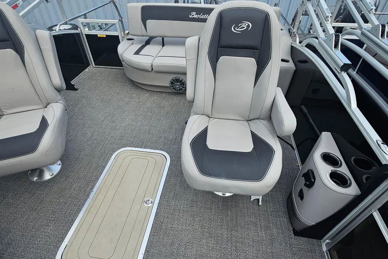 Slide: The Image of 2025 Barletta A22UC pontoon boat interior with plush seating and modern design. - 7