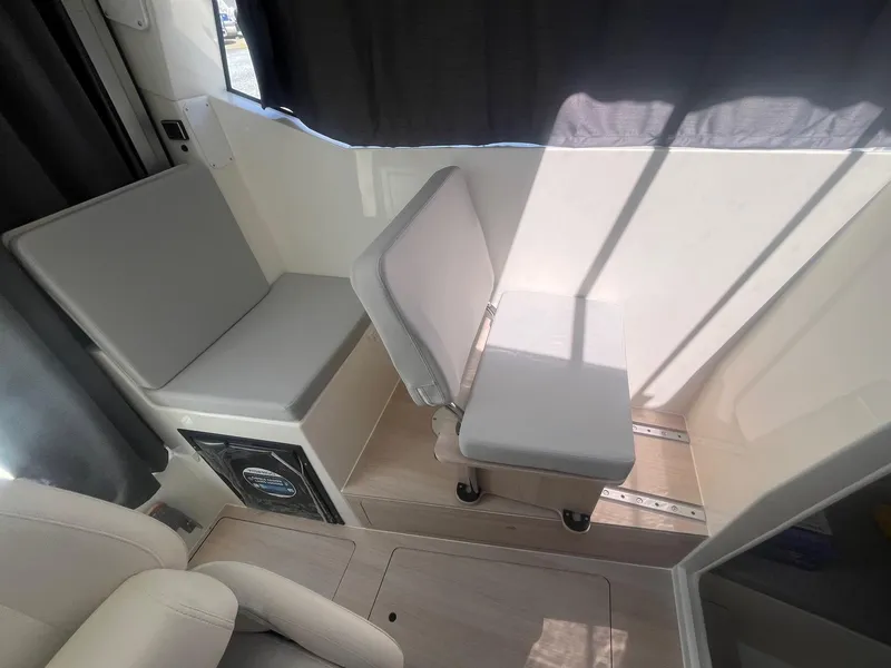 Slide: The Image of Interior seating of 2025 Bayliner Trophy T25 Pilothouse boat. - 11