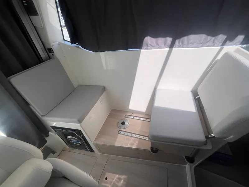 Slide: The Image of Interior seating of 2025 Bayliner Trophy T25 Pilothouse boat. - 16