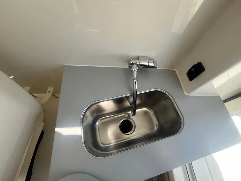 Slide: The Image of Stainless steel sink in 2025 Bayliner Trophy T25 Pilothouse boat interior. - 25