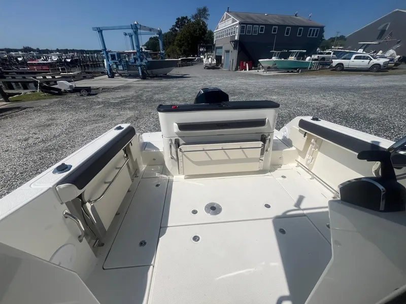 Slide: The Image of 2025 Bayliner Trophy T25 Pilothouse boat interior at a marina. - 26